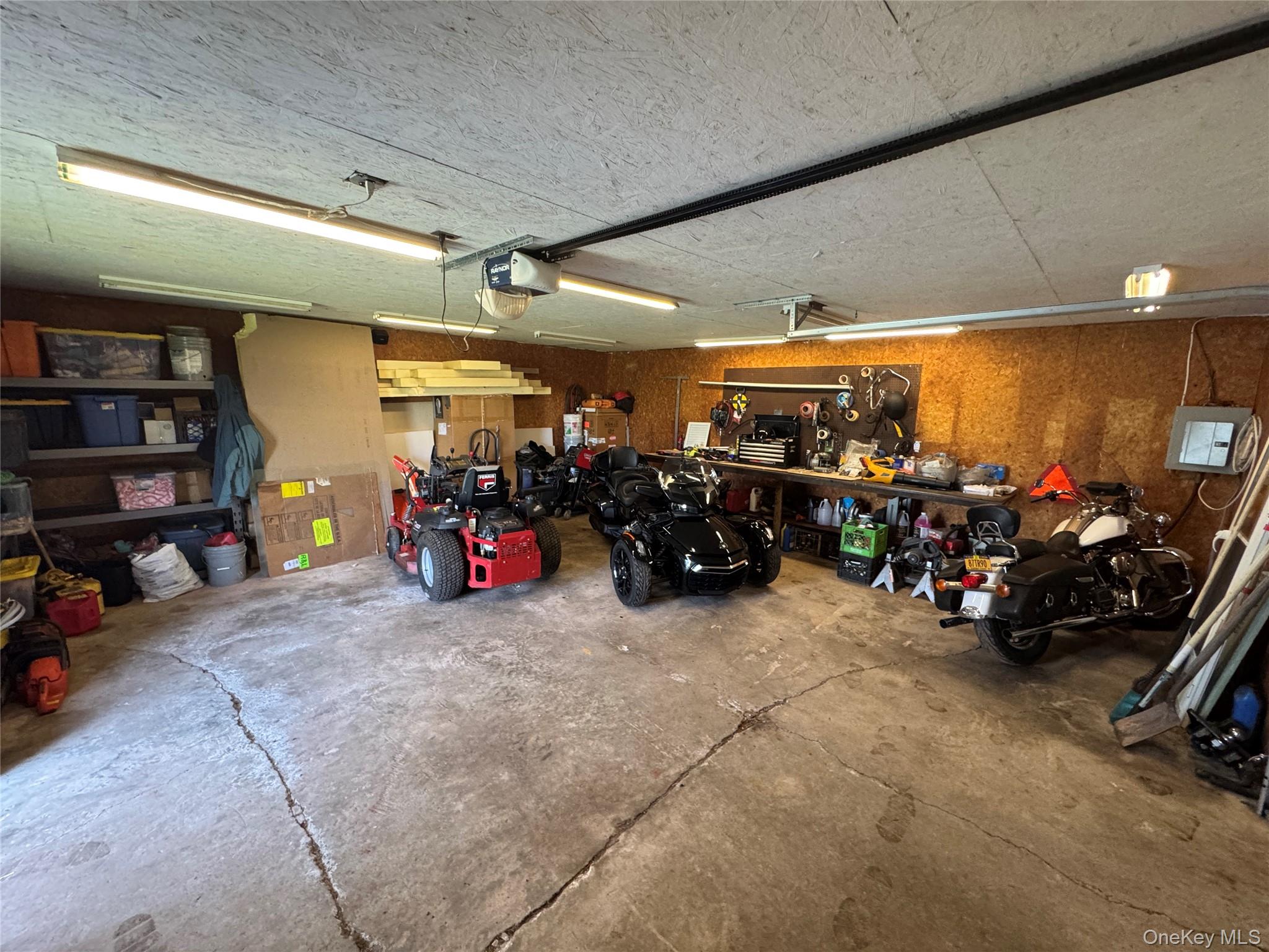 42 Fittkau Road Swan Lake, NY 12783 - Photo 32 of 36 a view of a garage with a bike and storage