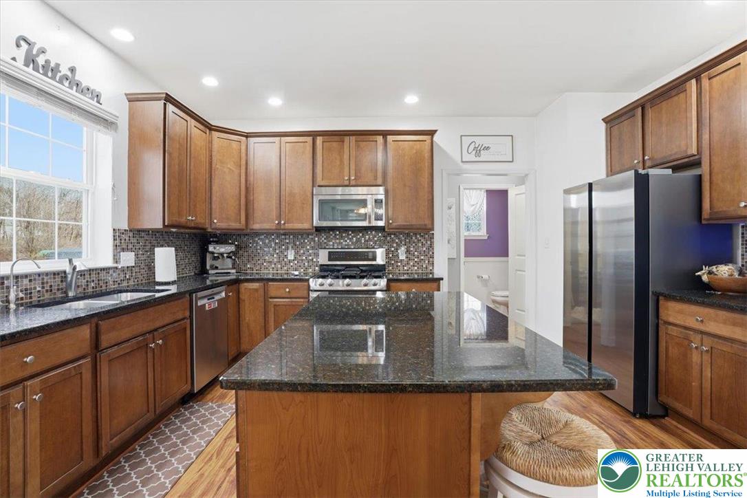 628 South 4th Street Bangor, PA 18013 - Photo 24 of 97 a kitchen with stainless steel appliances granite countertop a sink a stove and a refrigerator