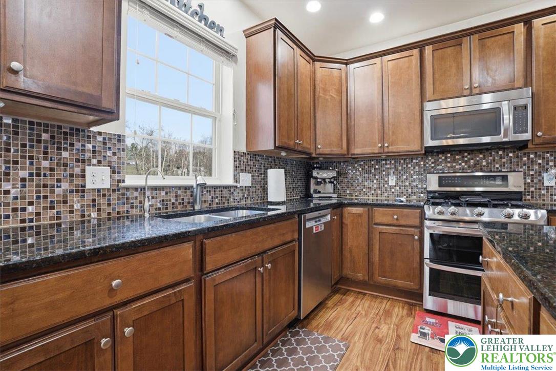 628 South 4th Street Bangor, PA 18013 - Photo 27 of 97 a kitchen with stainless steel appliances a sink stove and cabinets