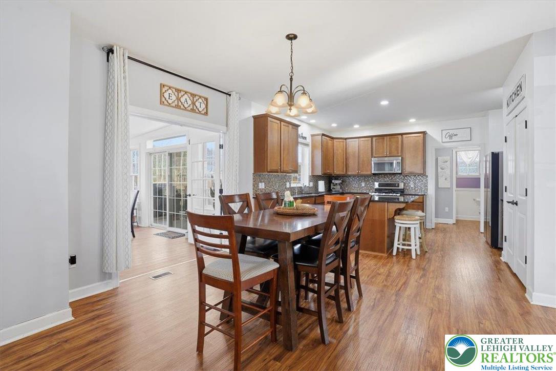 628 South 4th Street Bangor, PA 18013 - Photo 37 of 97 a view of a a dining room and livingroom with furniture wooden floor a chandelier