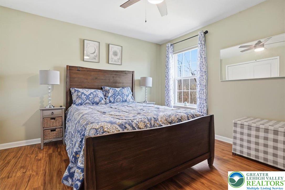 628 South 4th Street Bangor, PA 18013 - Photo 47 of 97 a bedroom with a bed and wooden floor