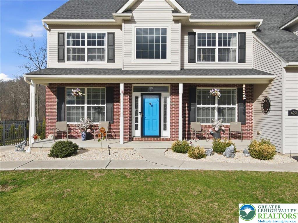 628 South 4th Street Bangor, PA 18013 - Photo 5 of 97 a front view of a house with a garden and porch