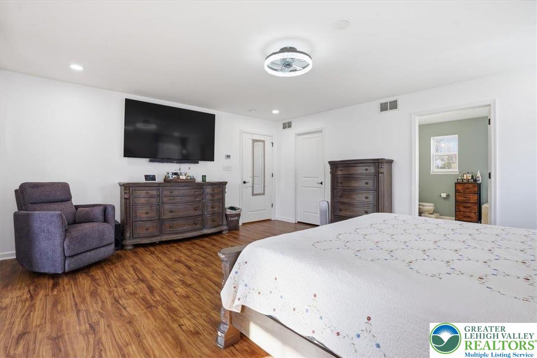 628 South 4th Street Bangor, PA 18013 - Photo 54 of 97 a bedroom with a bed and a flat screen television