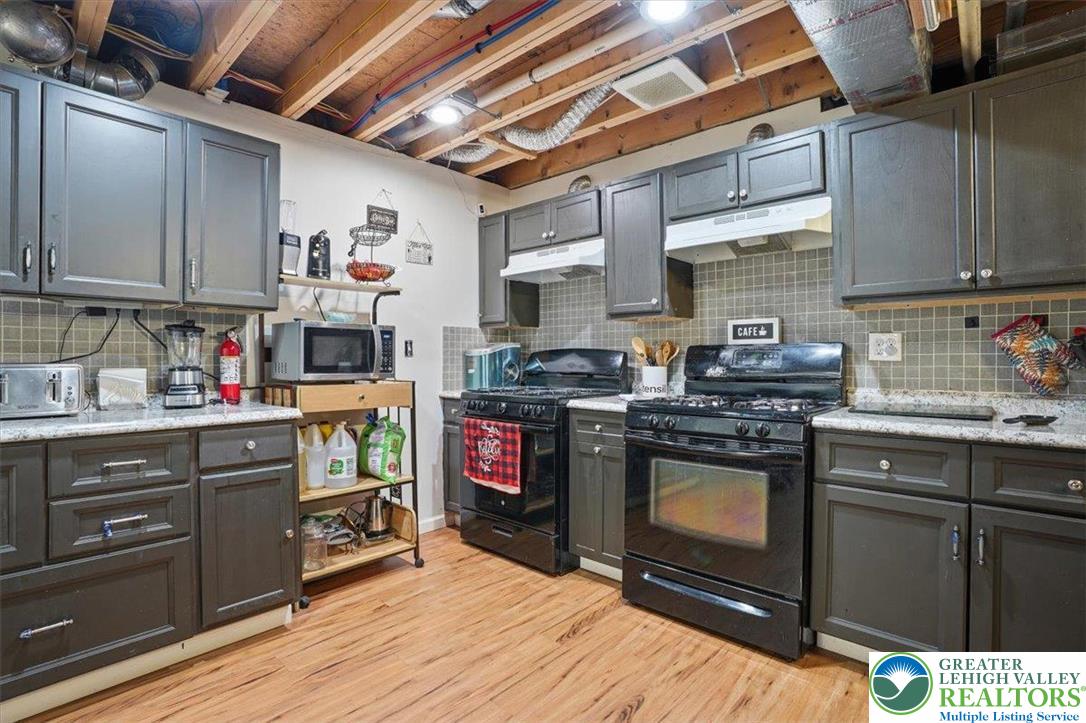 628 South 4th Street Bangor, PA 18013 - Photo 69 of 97 a kitchen with wooden cabinets and a stove top oven