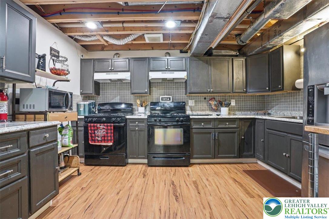628 South 4th Street Bangor, PA 18013 - Photo 70 of 97 a kitchen with stainless steel appliances granite countertop a sink a stove and cabinets