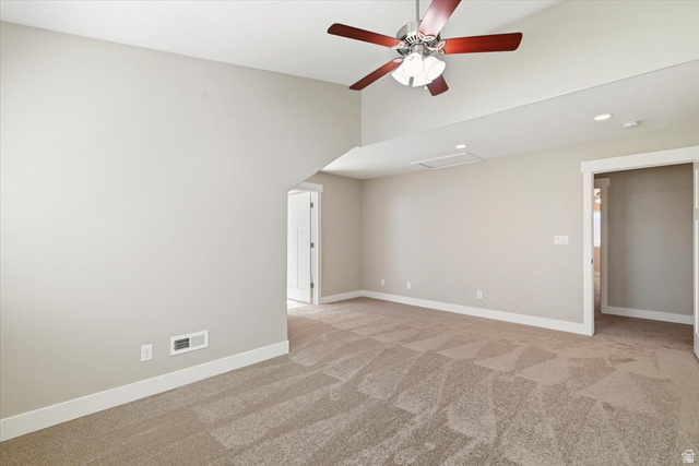 857 225 South Springville, UT 84663 - Photo 11 of 23 Spacious room featuring vaulted ceilings, light-toned walls, and patterned carpeting