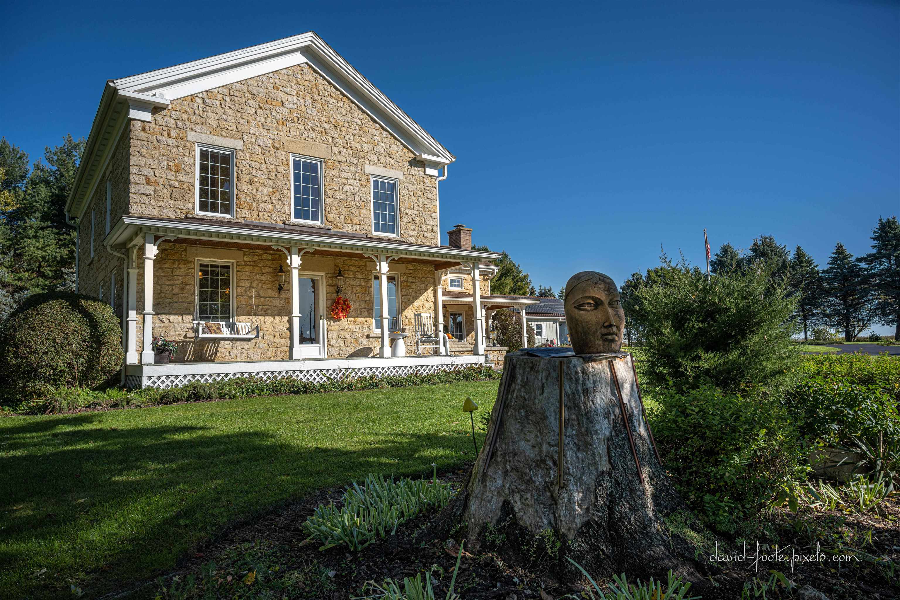 8936 North Cedarville Road Lena, IL 61048 - Photo 2 of 51 a front view of a house with a yard