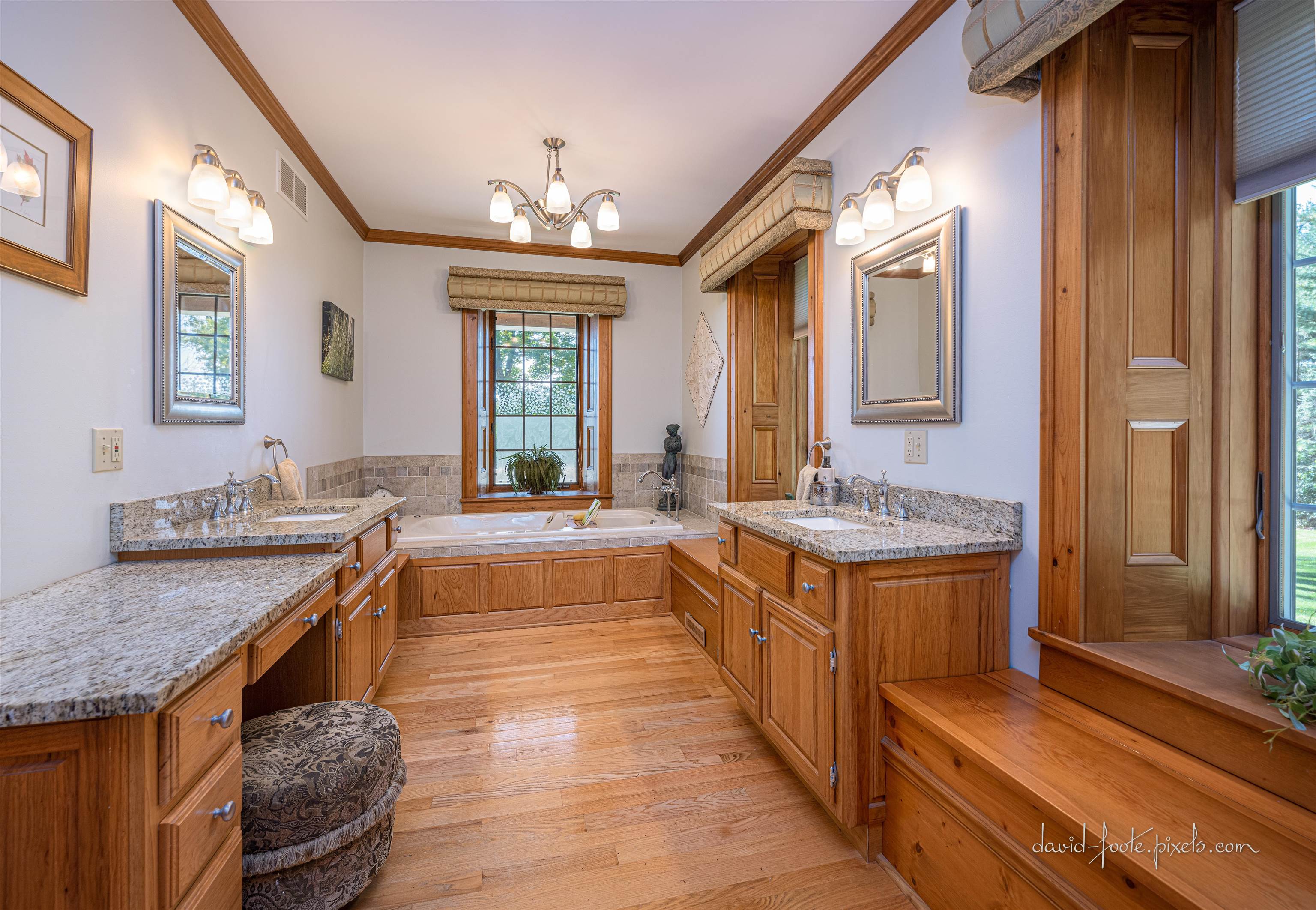 8936 North Cedarville Road Lena, IL 61048 - Photo 23 of 51 a spacious bathroom with a granite countertop sink a mirror and a bathtub