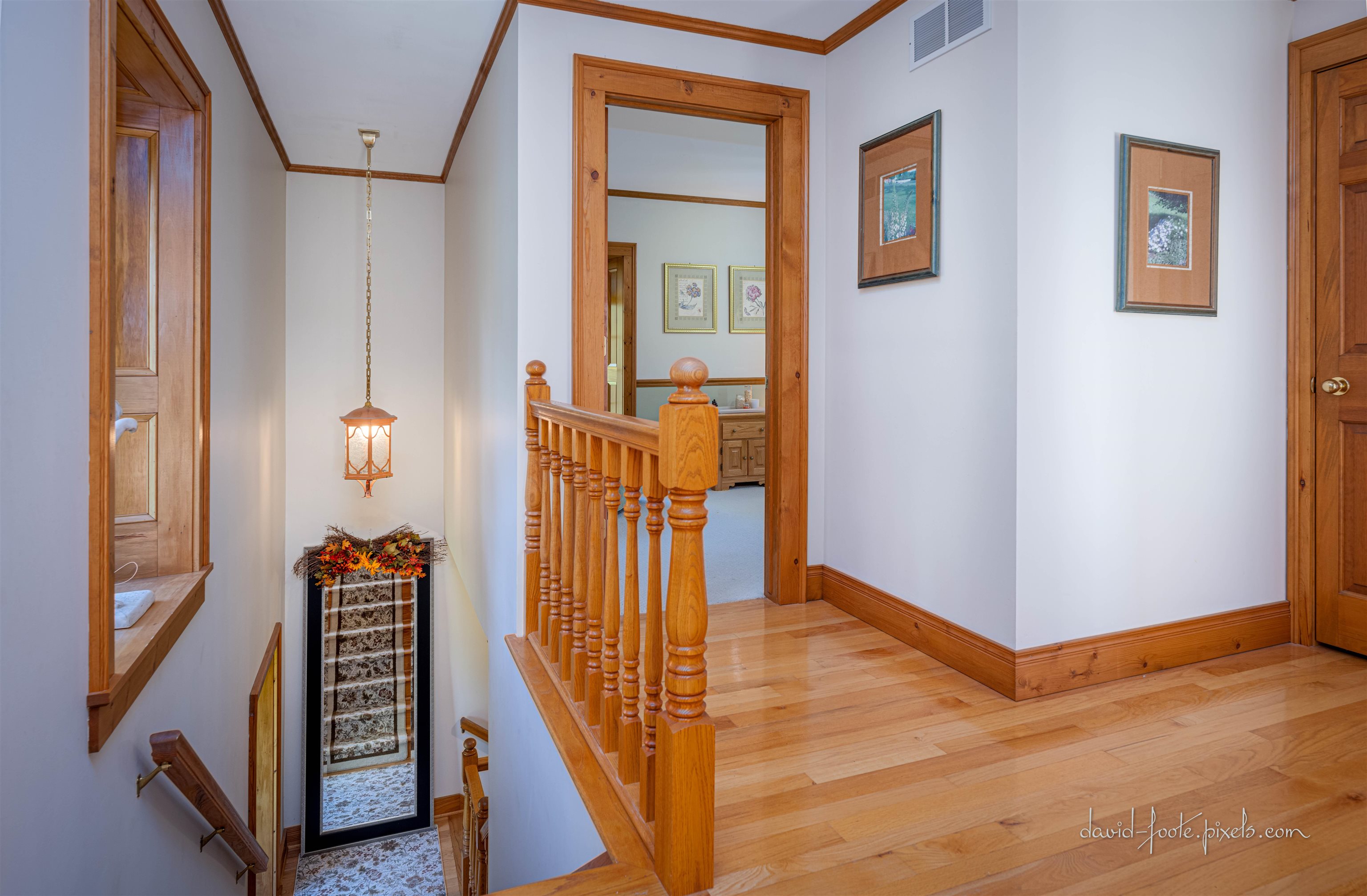 8936 North Cedarville Road Lena, IL 61048 - Photo 26 of 51 a view of a hallway with wooden floor and stairs