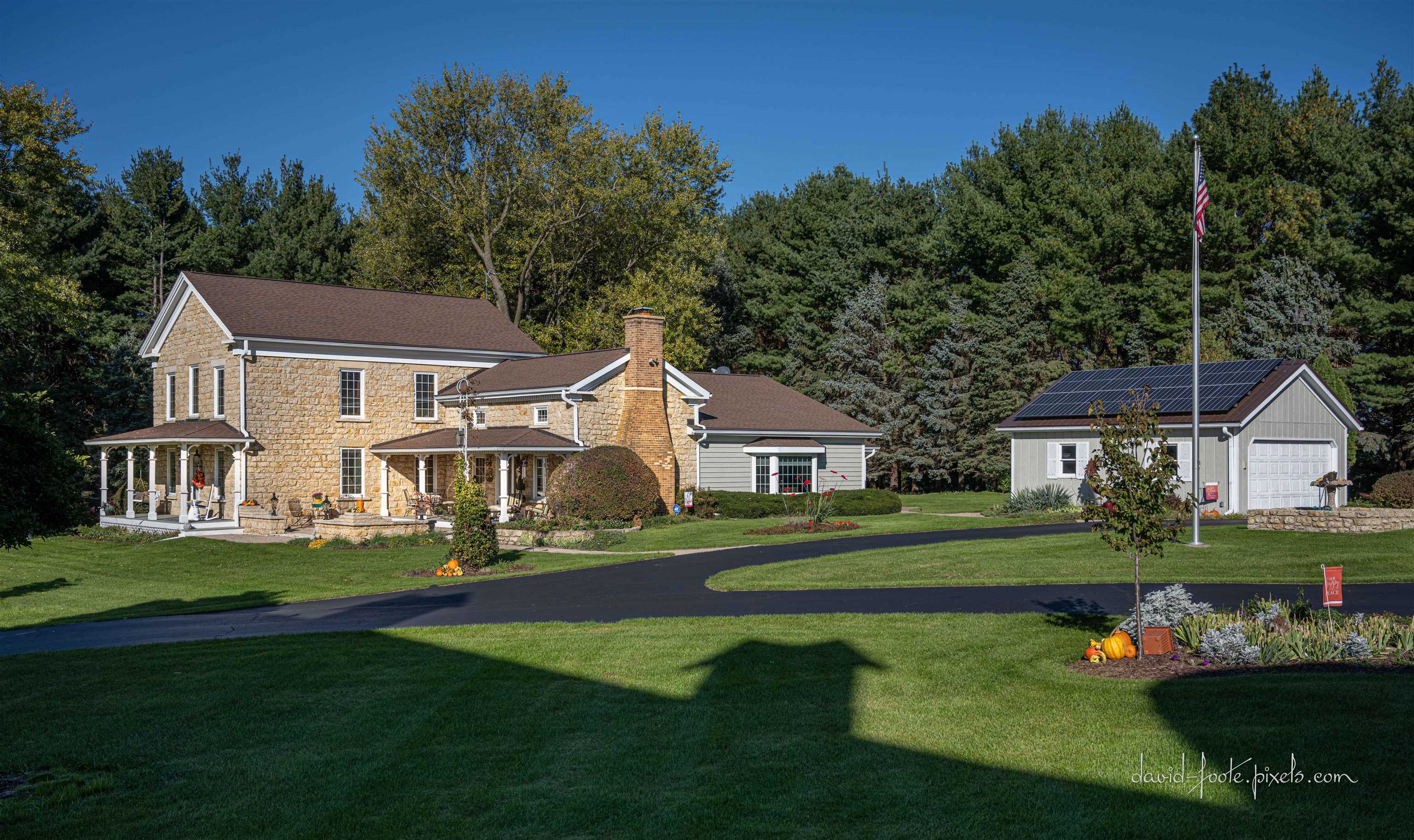 8936 North Cedarville Road Lena, IL 61048 - Photo 3 of 51 a front view of a house with a garden and trees
