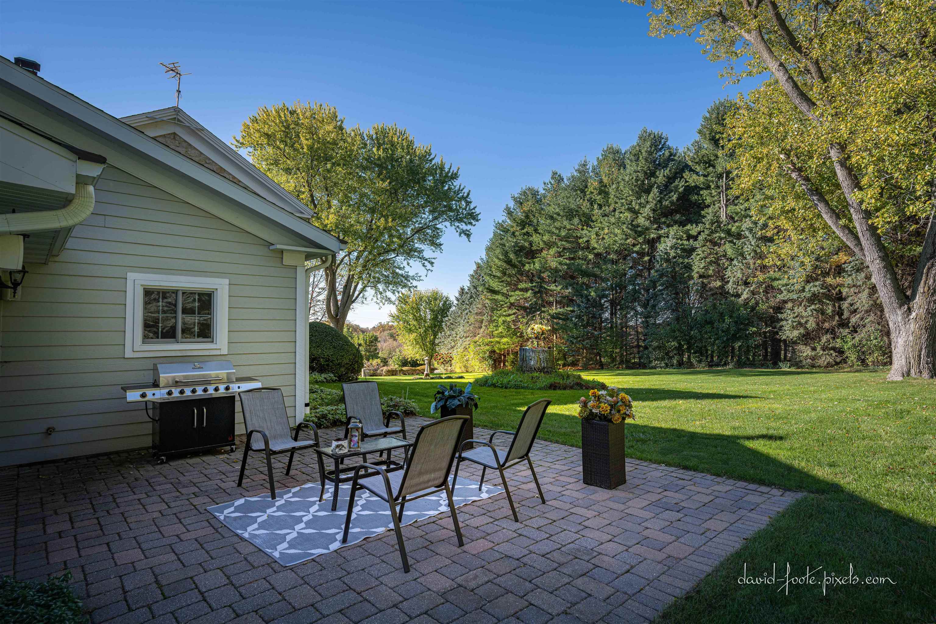 8936 North Cedarville Road Lena, IL 61048 - Photo 31 of 51 a view of a sitting area with a table and chair in patio