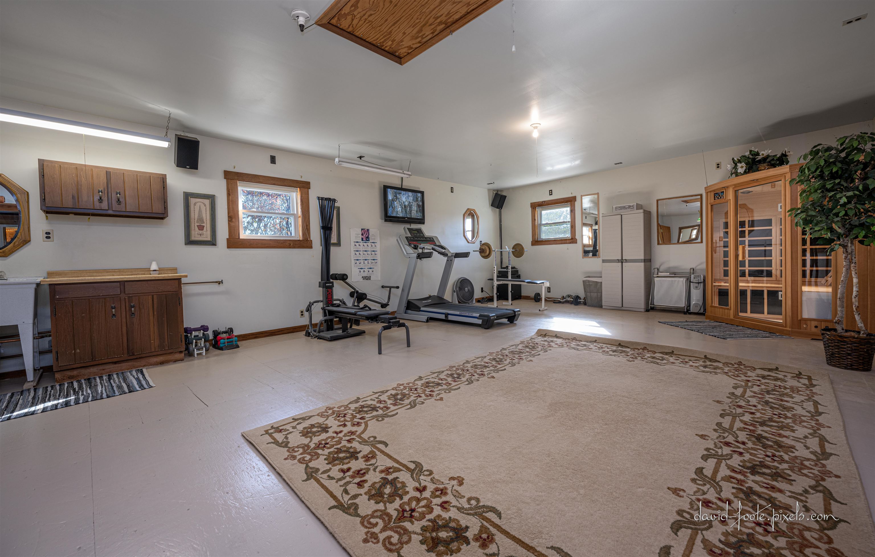 8936 North Cedarville Road Lena, IL 61048 - Photo 39 of 51 a living room with furniture gym equipment and a flat screen tv
