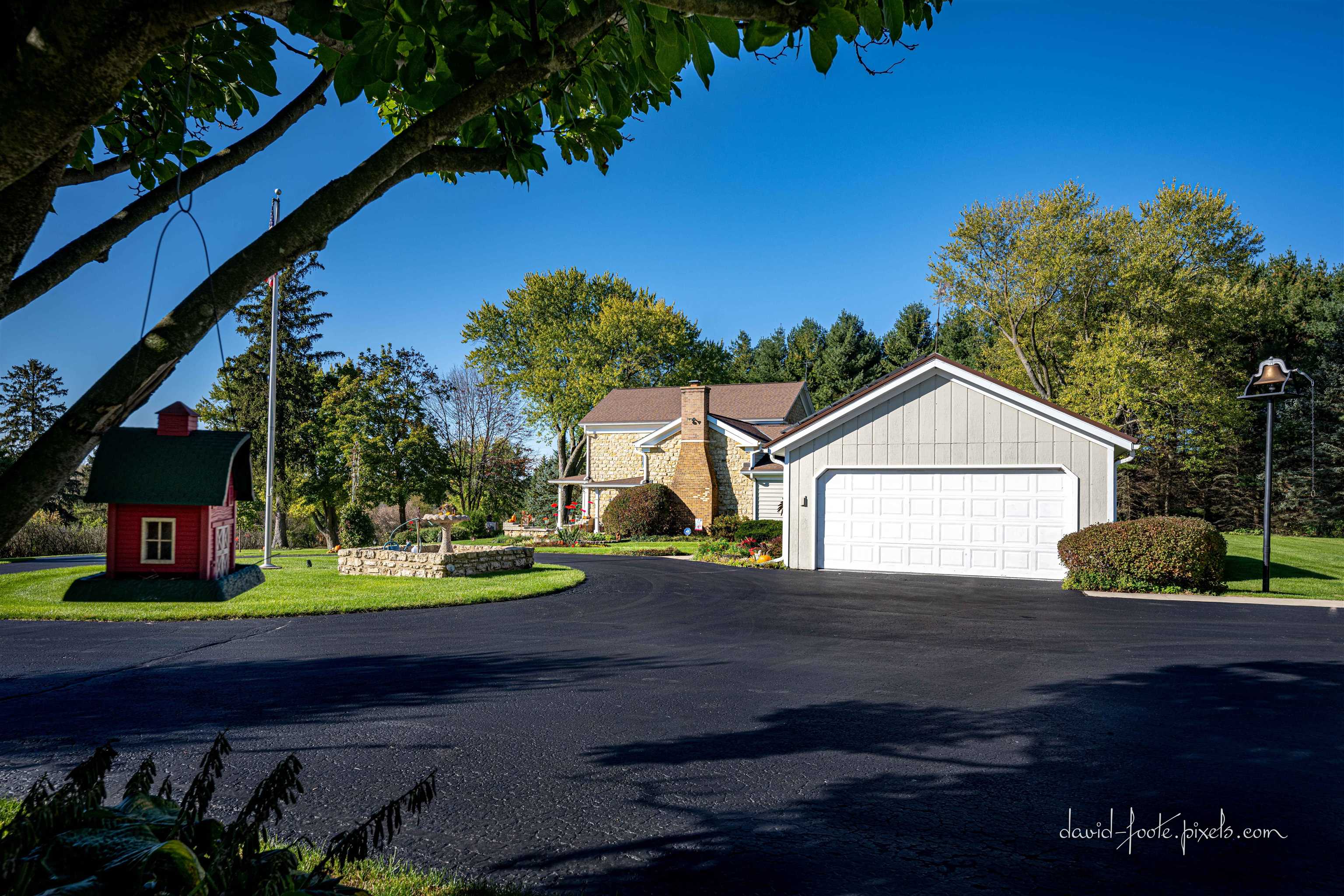 8936 North Cedarville Road Lena, IL 61048 - Photo 43 of 51 a front view of a house with a yard and garage