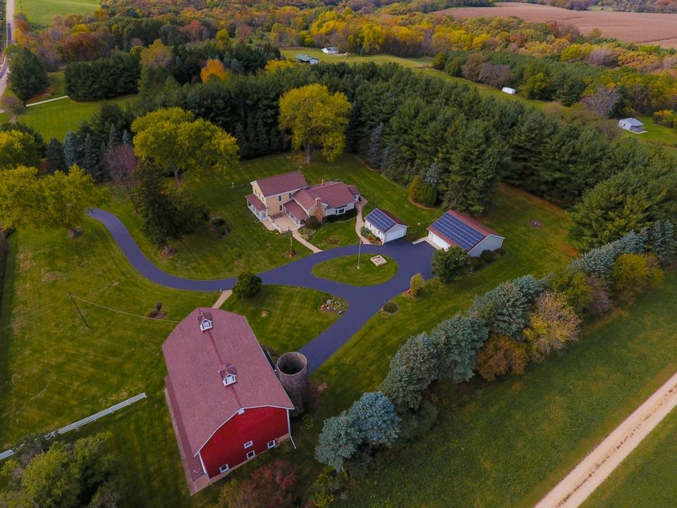 8936 North Cedarville Road Lena, IL 61048 - Photo 47 of 51 an aerial view of a house with a swimming pool yard and outdoor seating