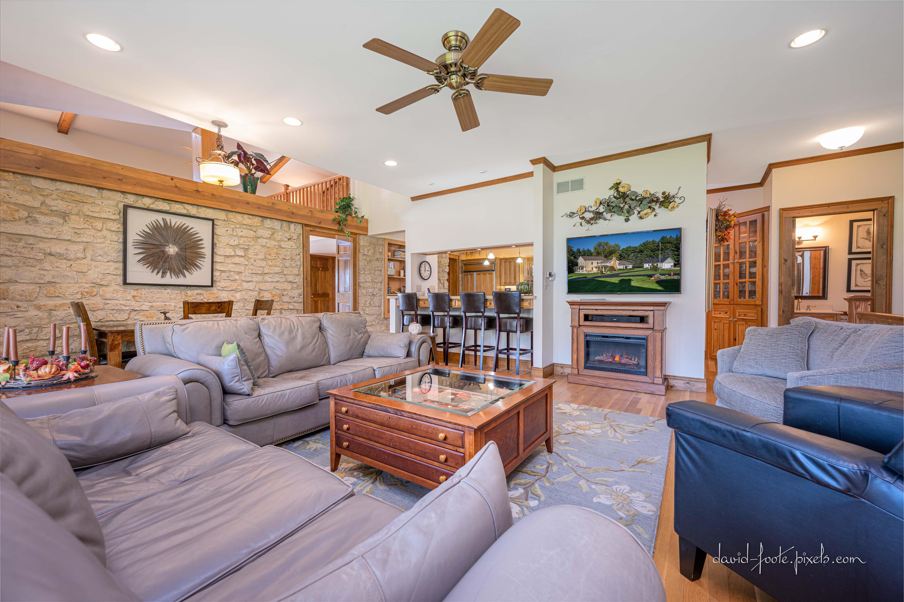 8936 North Cedarville Road Lena, IL 61048 - Photo 9 of 51 a living room with furniture a ceiling fan and a rug