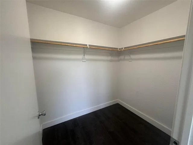 a view of an empty walk in closet