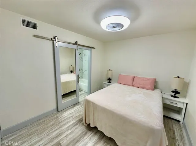 a bedroom with a bed and a dresser