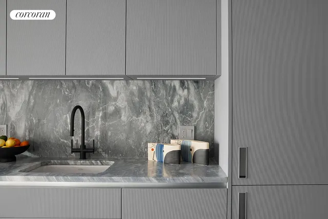 a kitchen with a sink and a stove top oven