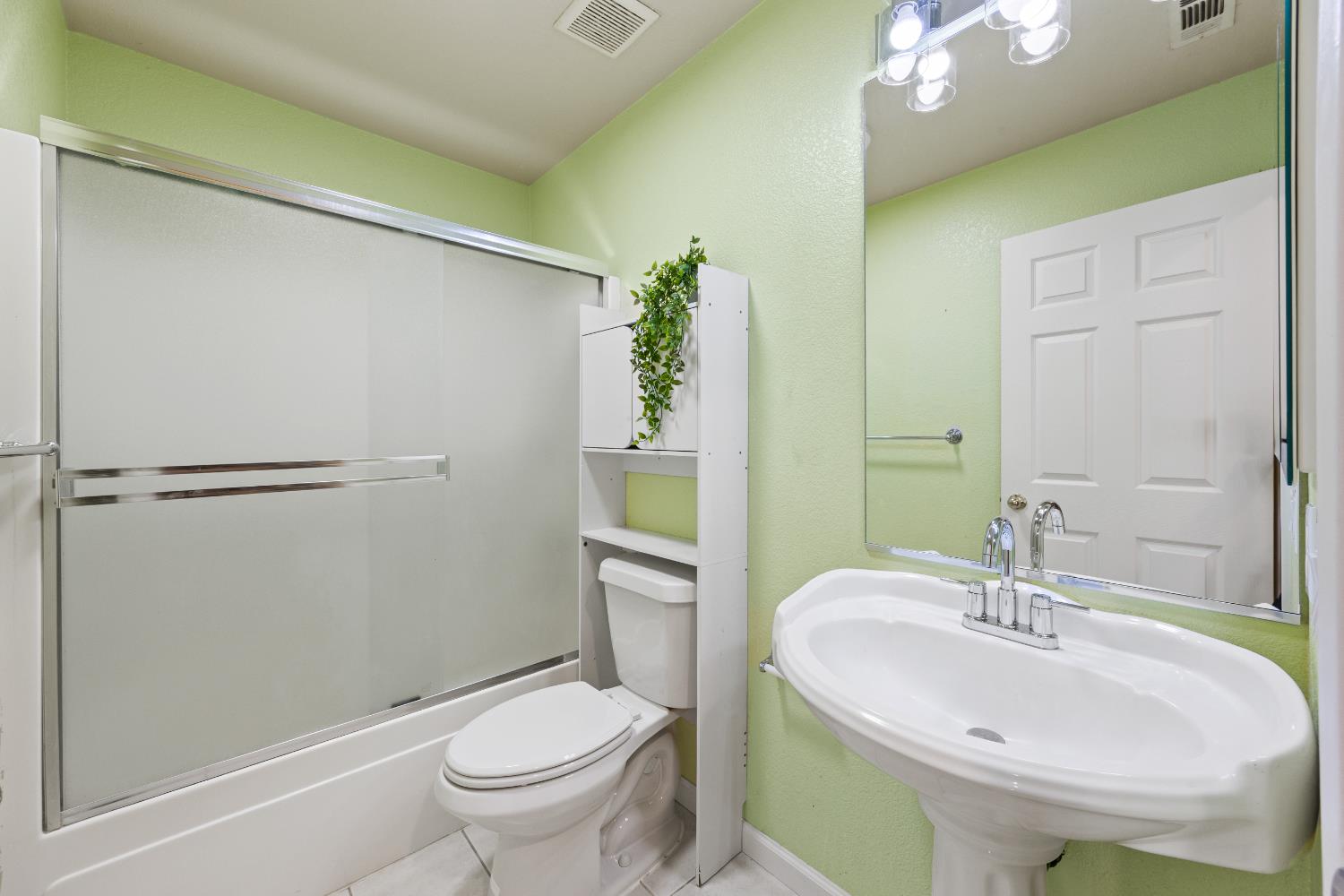 8926 Generations Court Elk Grove, CA 95758 - Photo 13 of 23 a bathroom with a sink toilet and shower