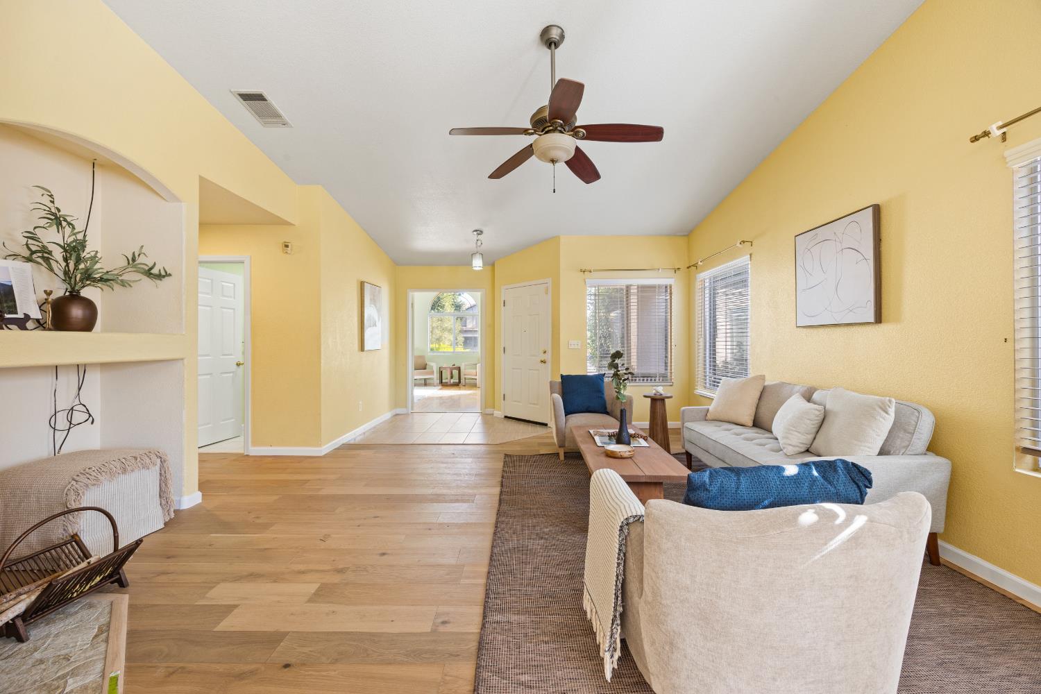 8926 Generations Court Elk Grove, CA 95758 - Photo 6 of 23 a living room with furniture and a chandelier