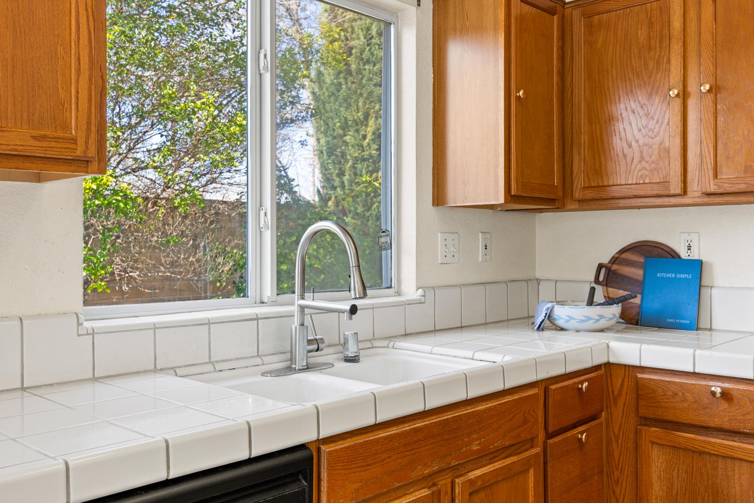 8926 Generations Court Elk Grove, CA 95758 - Photo 10 of 23 a kitchen with appliances cabinets and a sink