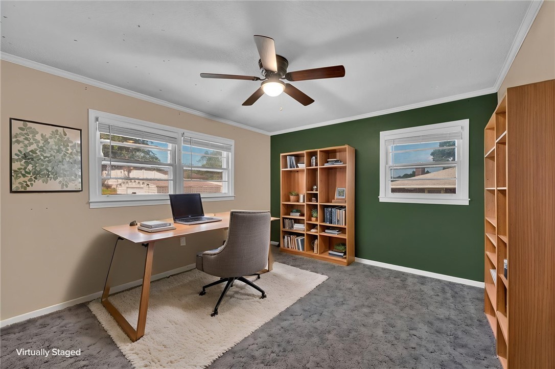 121 Wilson Road Anderson, SC 29625 - Photo 24 of 40 Plentiful natural light streams across the carpeted flooring from multiple wide windows.