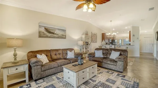 a kitchen with granite countertop a table and chairs in it
