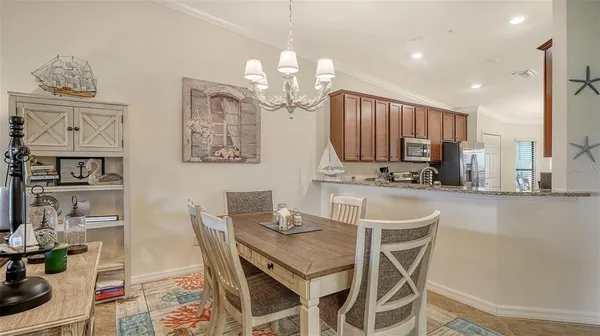 a kitchen with stainless steel appliances granite countertop a sink stove microwave and refrigerator