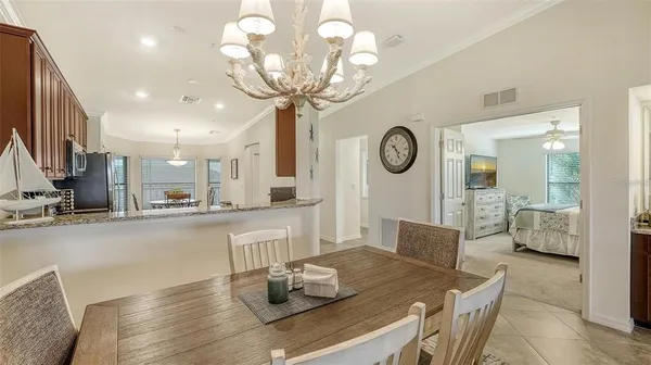 a kitchen with sink and refrigerator