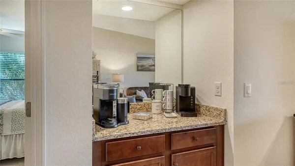 a kitchen with stainless steel appliances a stove a sink cabinets and a refrigerator