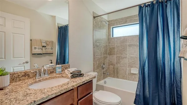 a view of a golf course with a ocean view