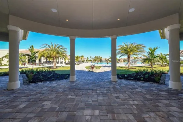 a view of a house with a small yard and plants