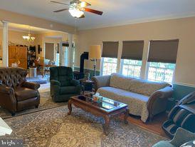 7575 Moormont Road Rapidan, VA 22733 - Photo 29 of 59 a living room with furniture and a large window