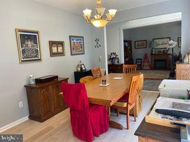 7575 Moormont Road Rapidan, VA 22733 - Photo 46 of 59 a view of a dining room with furniture and a chandelier