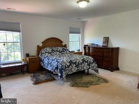 7575 Moormont Road Rapidan, VA 22733 - Photo 49 of 59 a bedroom with a bed dresser and a window