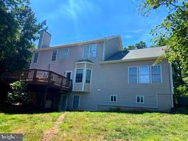 7575 Moormont Road Rapidan, VA 22733 - Photo 6 of 59 a front view of a house with a yard