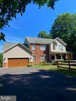 7575 Moormont Road Rapidan, VA 22733 - Photo 9 of 59 a front view of a house with a yard