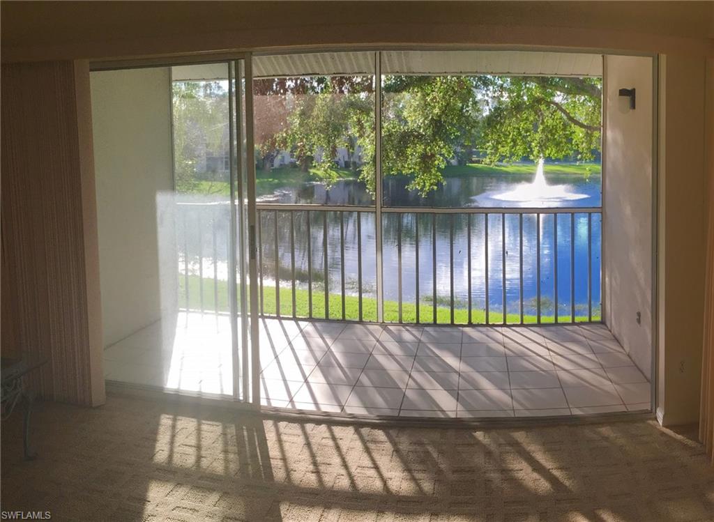 240 Timber Lake Circle, Unit D202 Naples, FL 34104 - Photo 1 of 23 a view of wooden floor