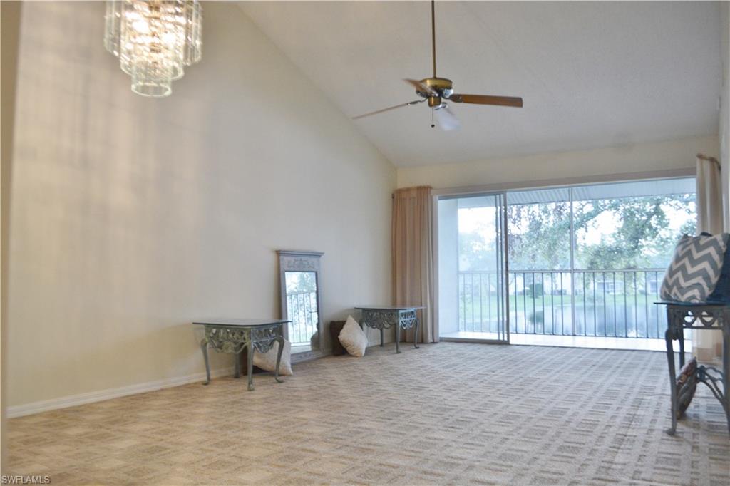 240 Timber Lake Circle, Unit D202 Naples, FL 34104 - Photo 4 of 23 a view of an empty room with a window
