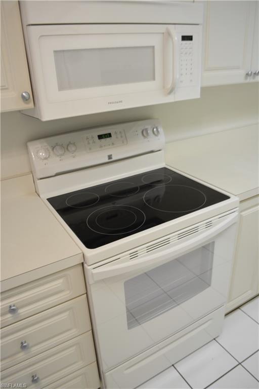 240 Timber Lake Circle, Unit D202 Naples, FL 34104 - Photo 7 of 23 a close view of stove