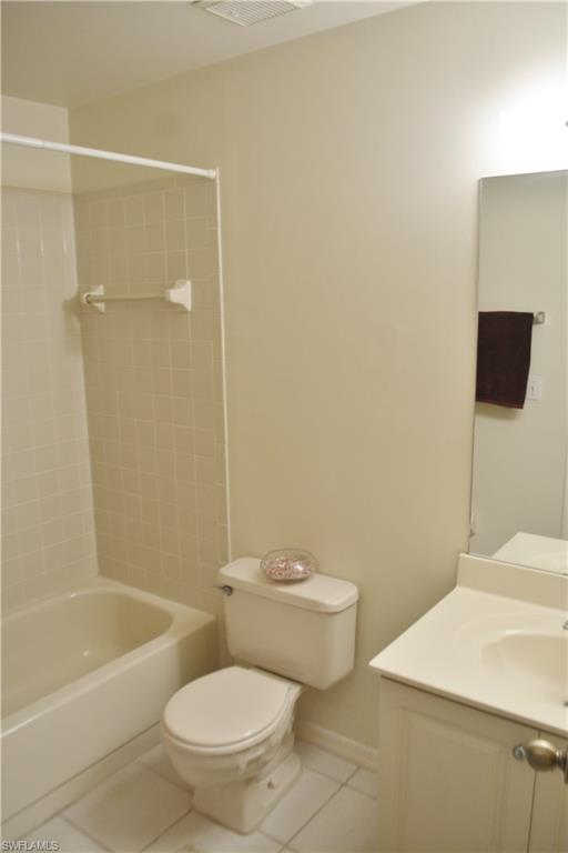 240 Timber Lake Circle, Unit D202 Naples, FL 34104 - Photo 10 of 23 a bathroom with a toilet a sink and bathtub