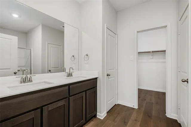 a view of a room with wooden floor and a large window