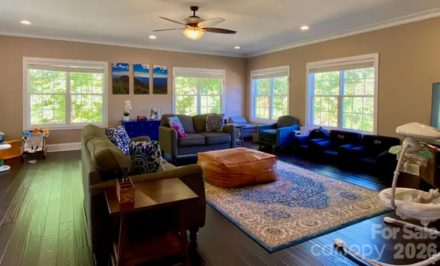 a view of an entryway with wooden floor door windows and a front door