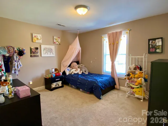 a bathroom with a toilet a sink and a mirror