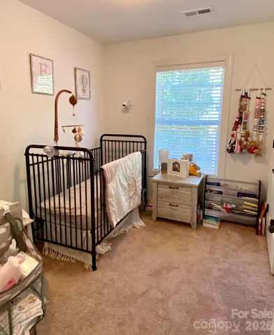 a view of a house with a tree