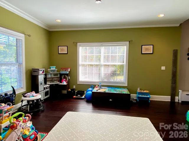 a kitchen with granite countertop cabinets stainless steel appliances a sink and a window