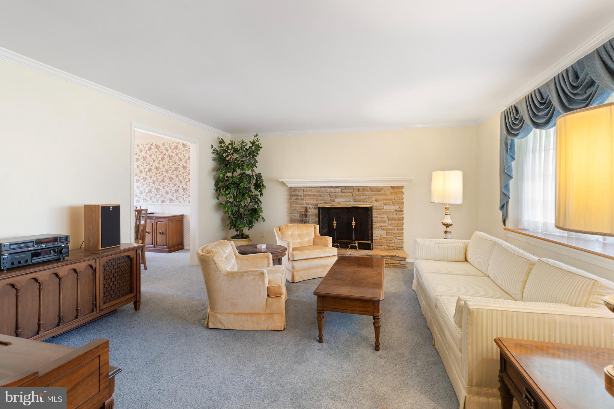 119 East Padonia Road Lutherville-Timonium, MD 21093 - Photo 13 of 39 a living room with furniture and a fireplace