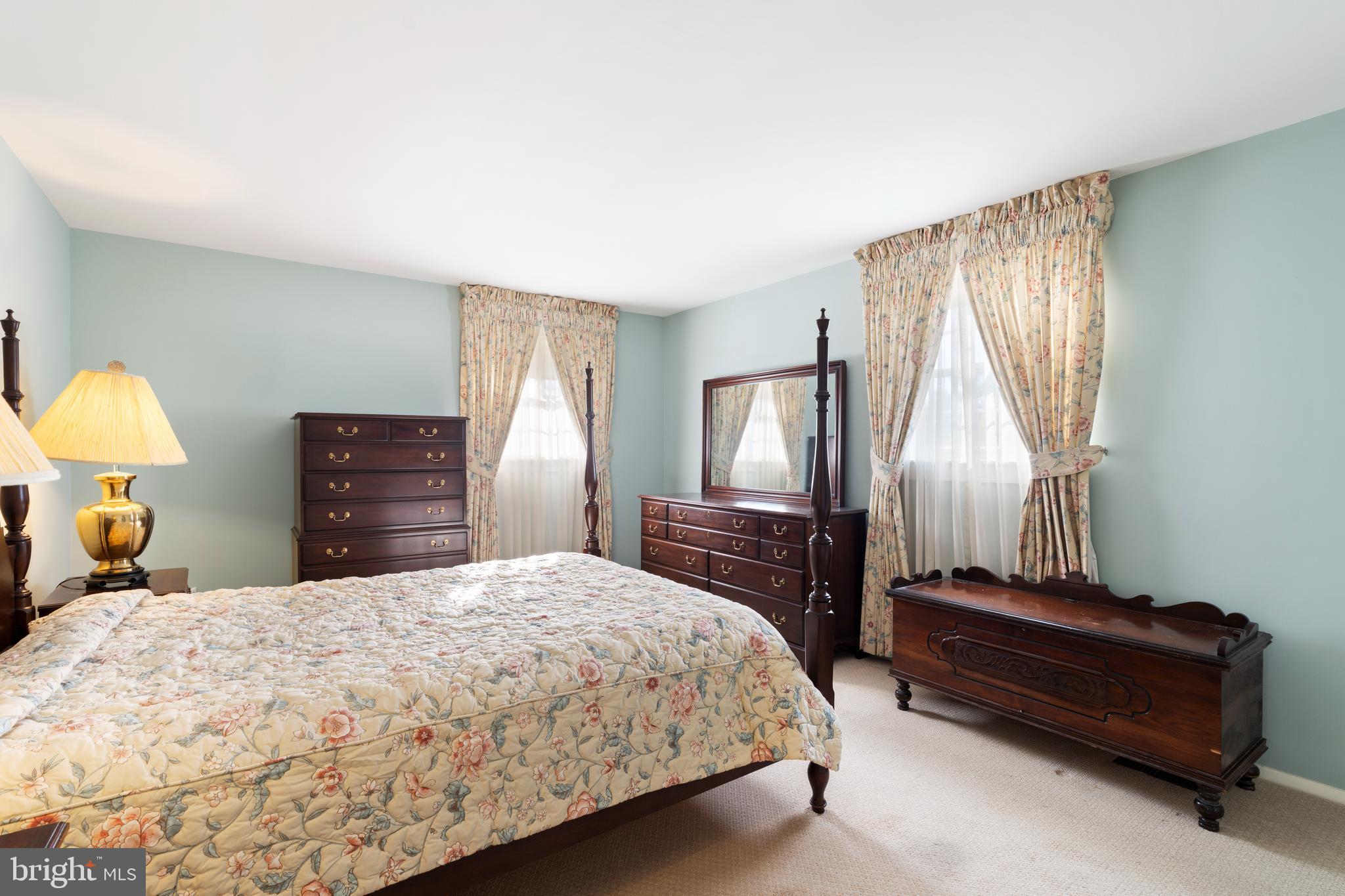 119 East Padonia Road Lutherville-Timonium, MD 21093 - Photo 15 of 39 a bedroom with a bed and dresser with mirror