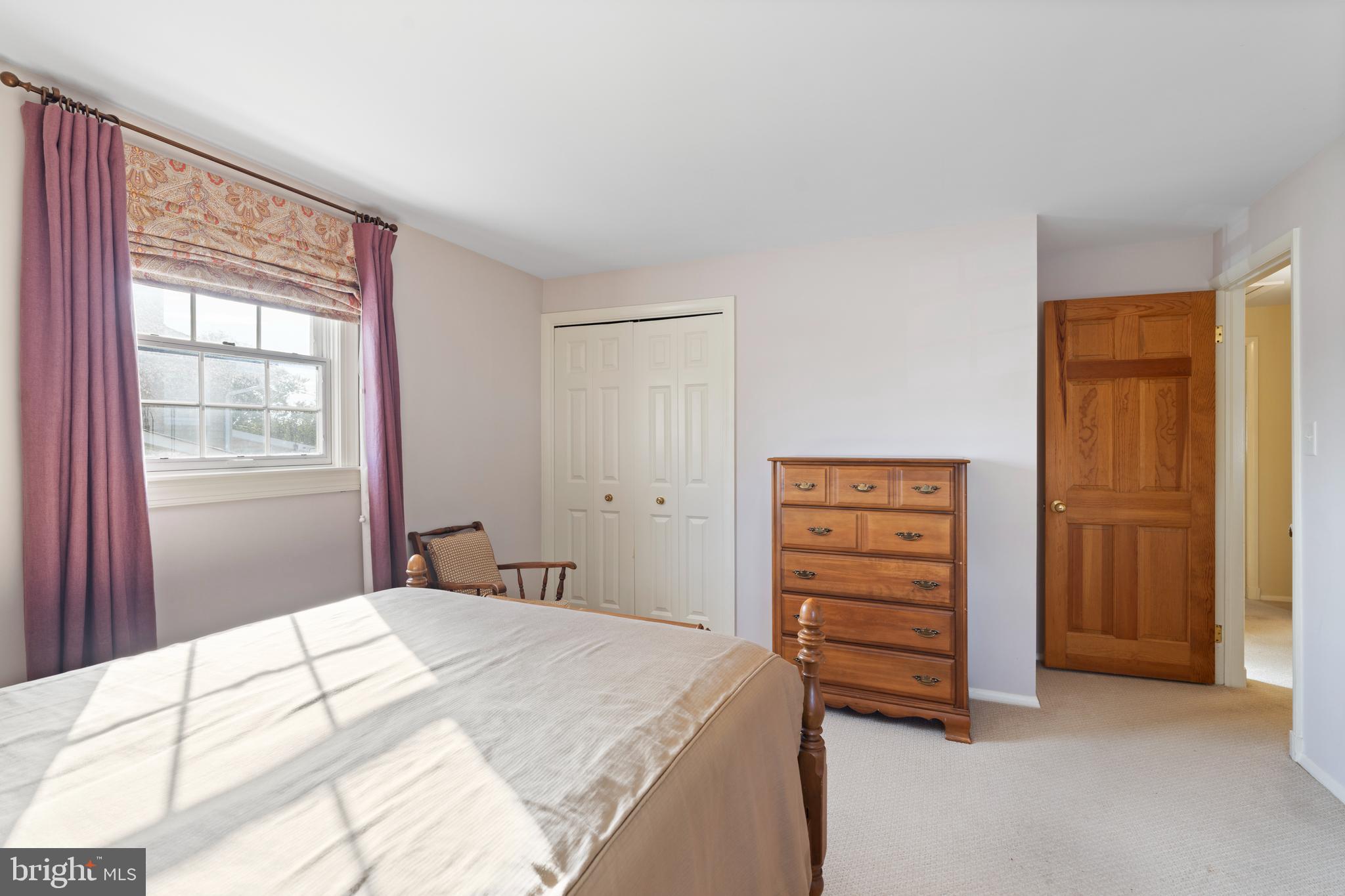 119 East Padonia Road Lutherville-Timonium, MD 21093 - Photo 19 of 39 a bedroom with a bed and a dresser