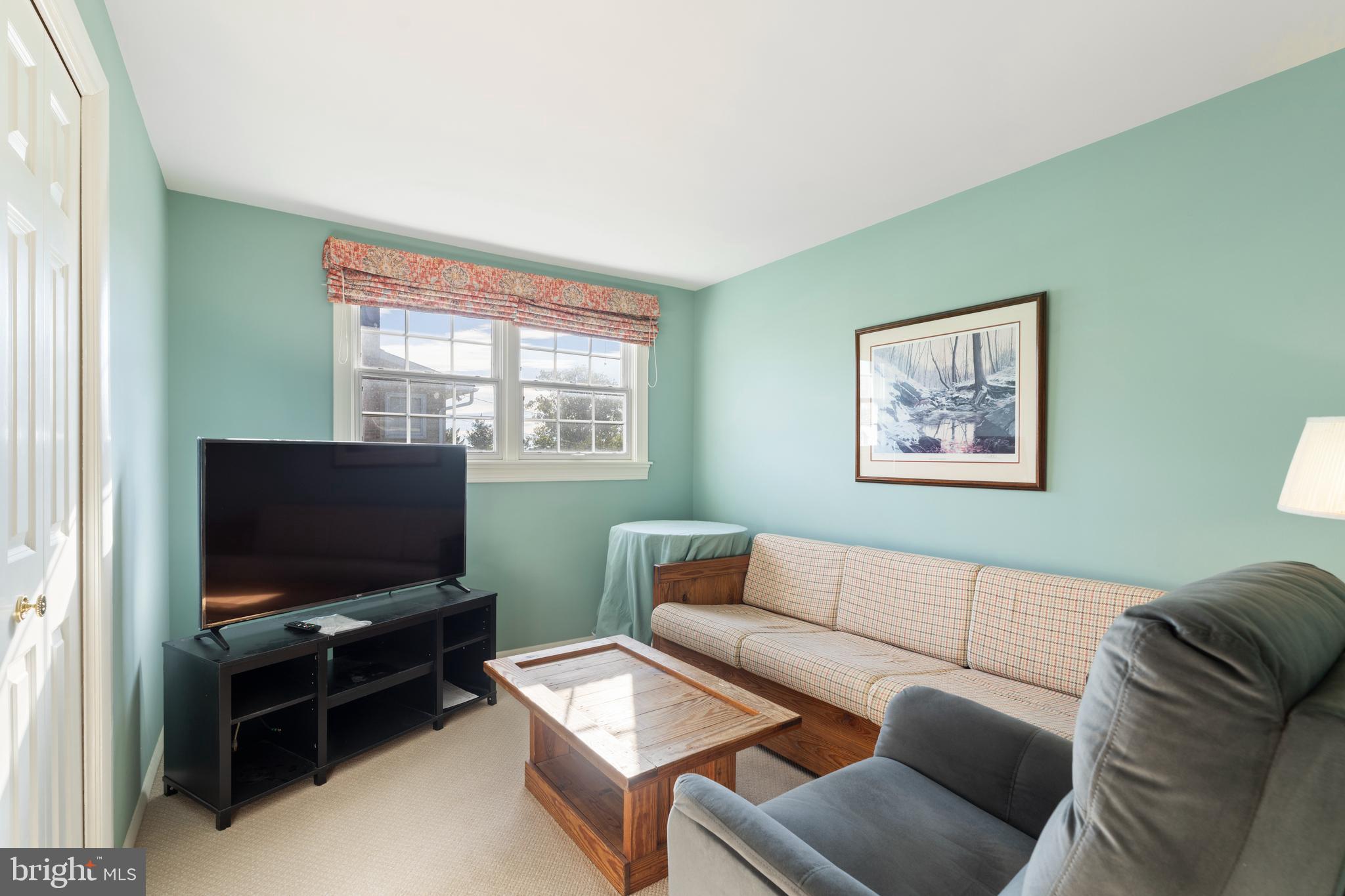119 East Padonia Road Lutherville-Timonium, MD 21093 - Photo 24 of 39 a living room with furniture and a flat screen tv